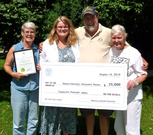 MPP Bill Murdoch presents a cheque to Sheatre on behalf of the Ontario Ministry of Health Promotion.